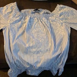 A long sleeve baby blue shirt wore once